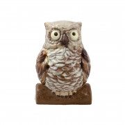 Chocolate mold owl on tree trunk