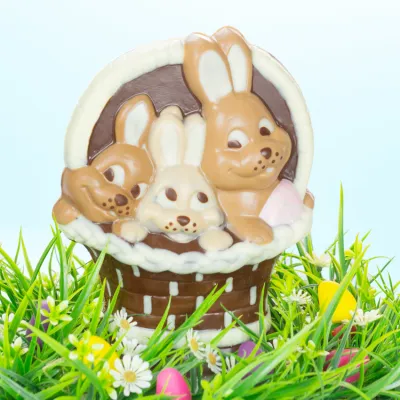 Chocolate mold bunnies in basket for sweet chocolate figures