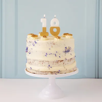 Number candle 8 with white and gold