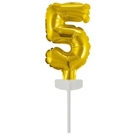 Gold foil balloon no. 5 as a cake topper