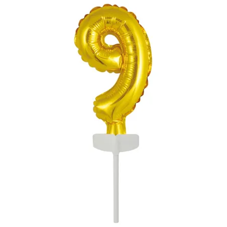 Gold foil balloon no. 9 as a cake topper
