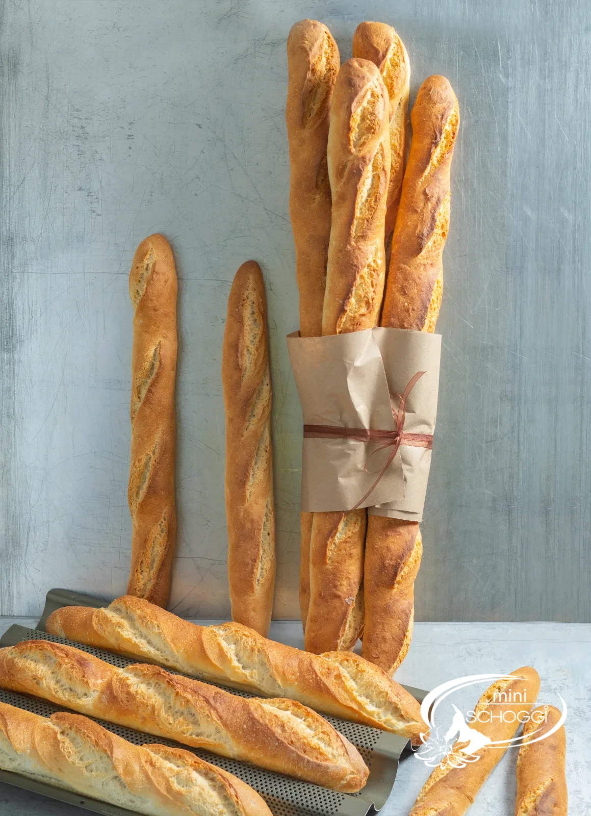 Golden-brown baked loaves in the oven with a crisp crust