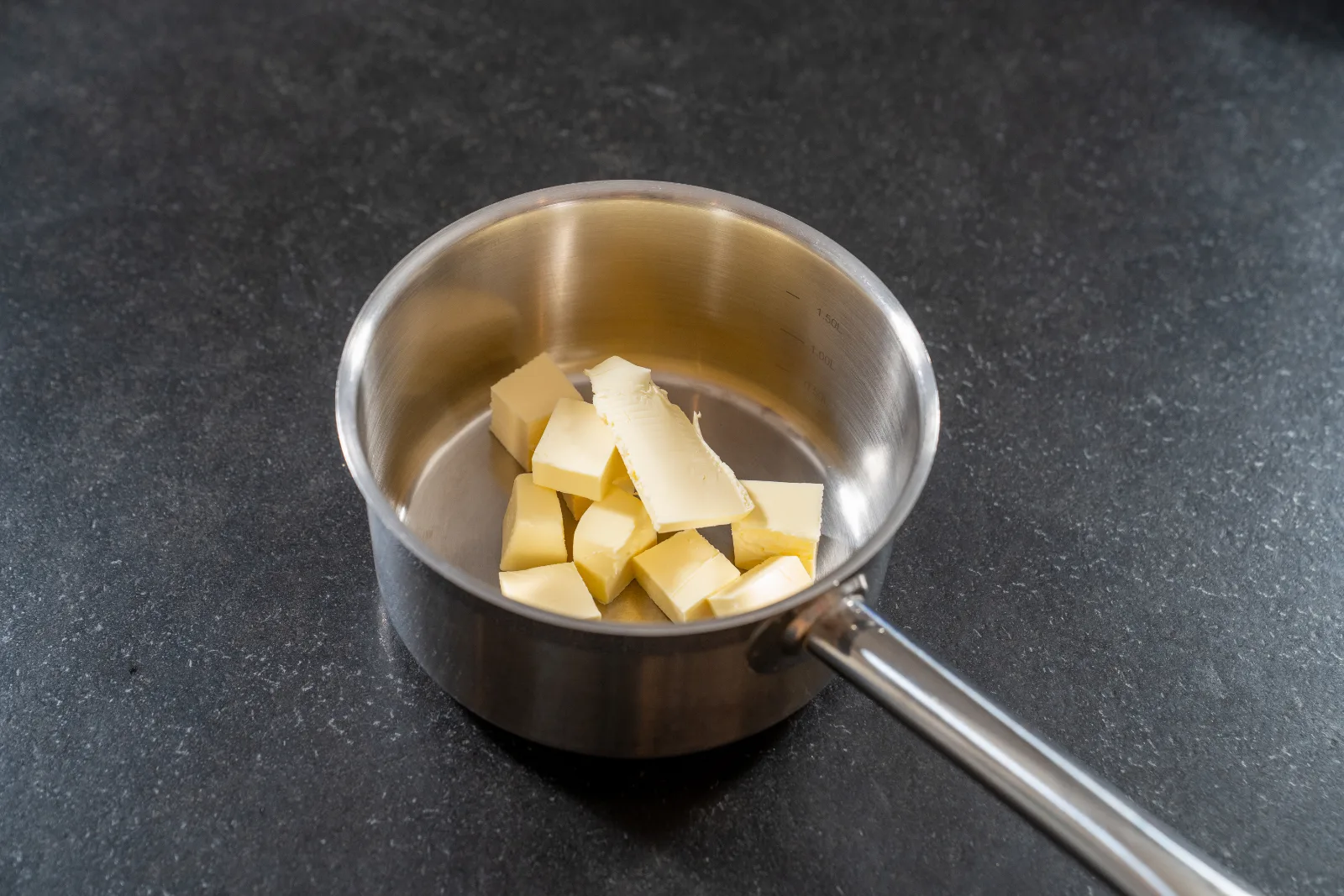 Cubes of butter in a pan before browning