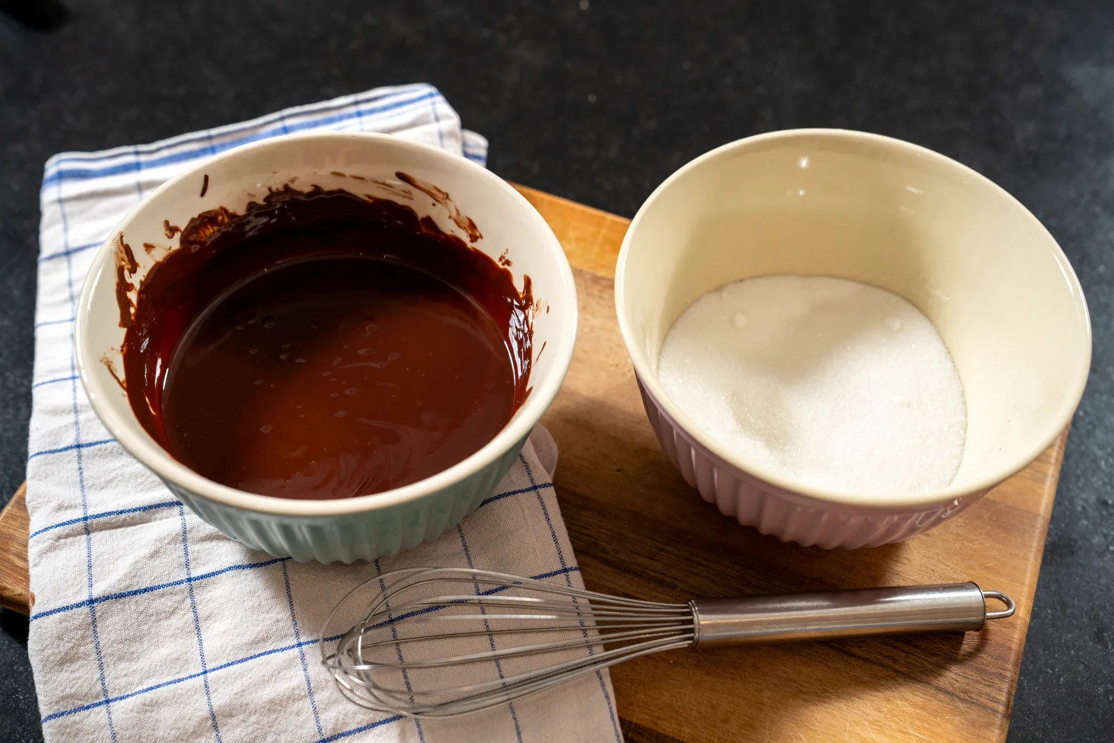 Melted chocolate mixture cooling in the bowl