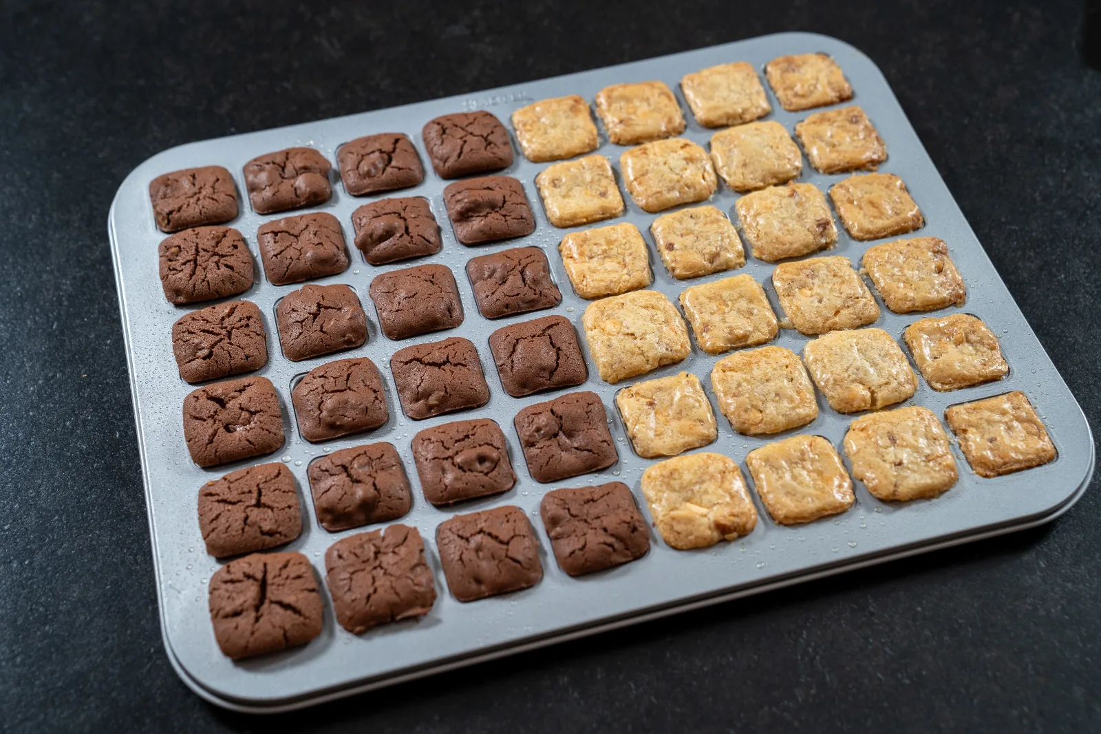Baked brownies and blondies in the mini baking tin after baking