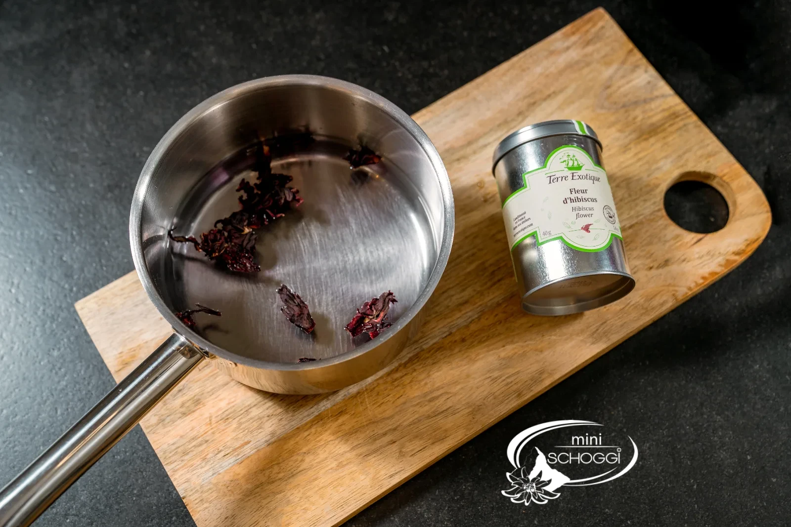 Bring water to the boil and add hibiscus flowers
