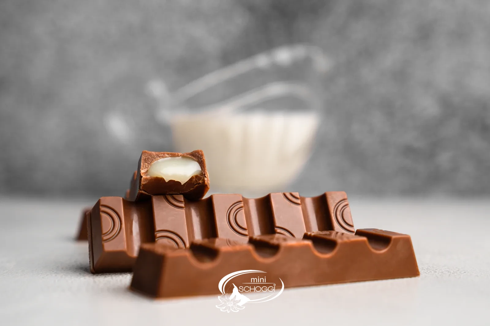 Homemade chocolate bars with light condensed milk ganache, sliced open